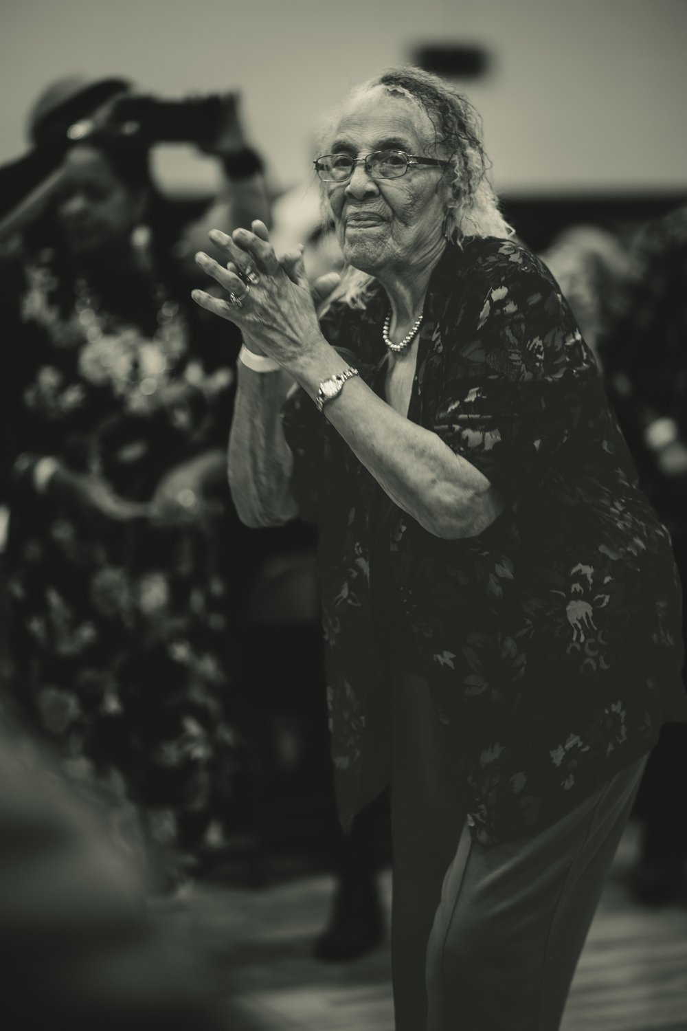 A Black Creole elder dancing at a community gathering in Louisiana
